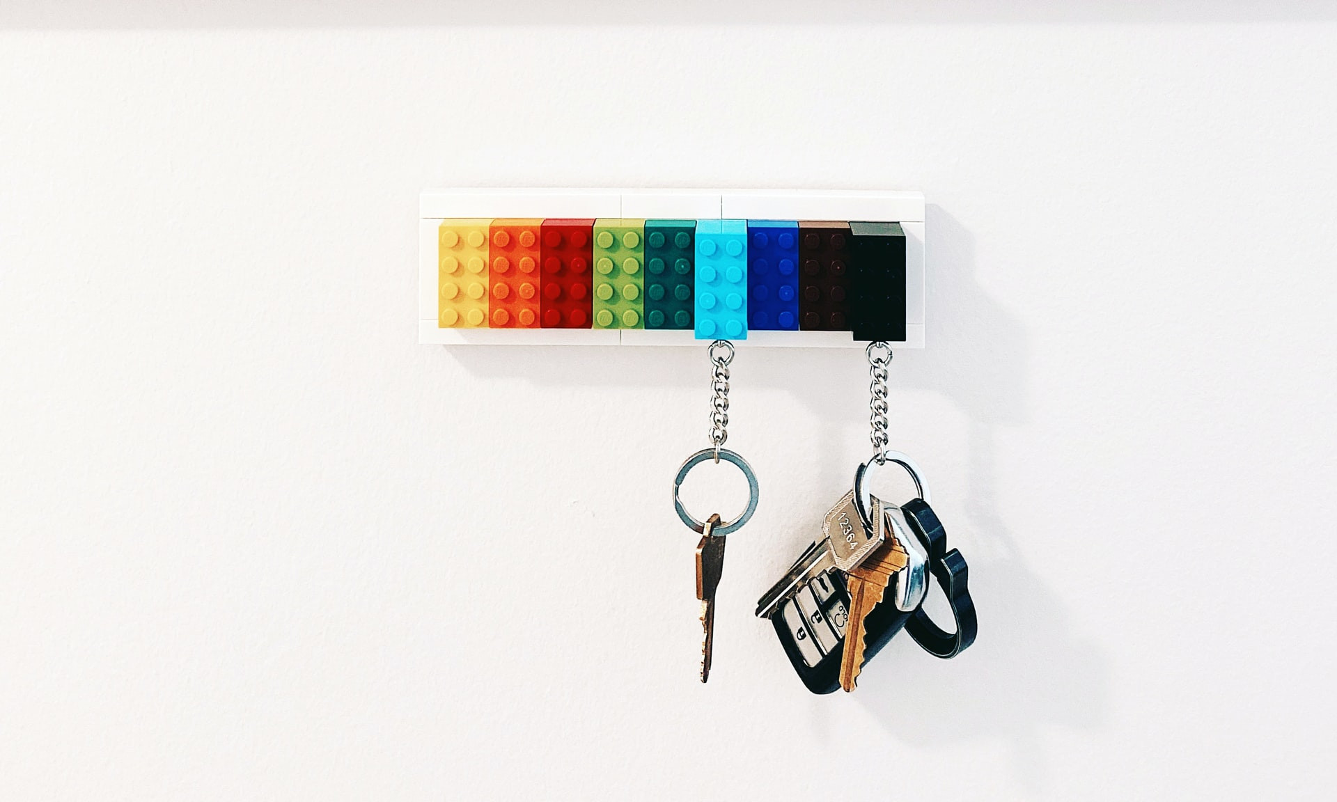 Keys hanging from colourful lego-block keyholder