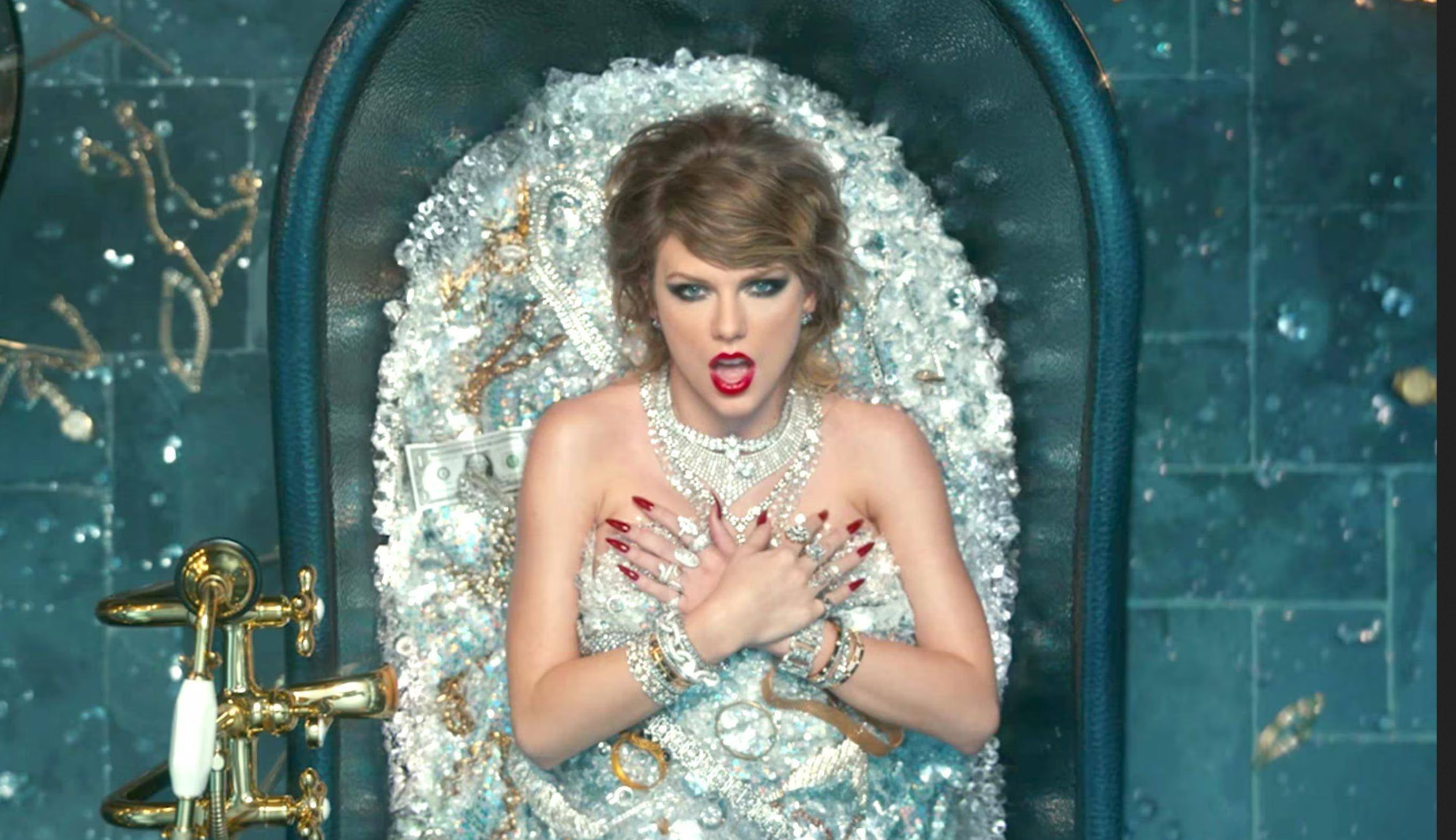 Photo of Taylor Swift in a bathtub full of money and jewels.
