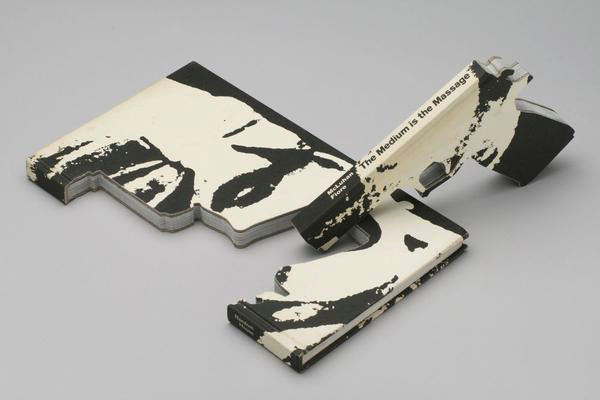 A book carved into the shape of a gun