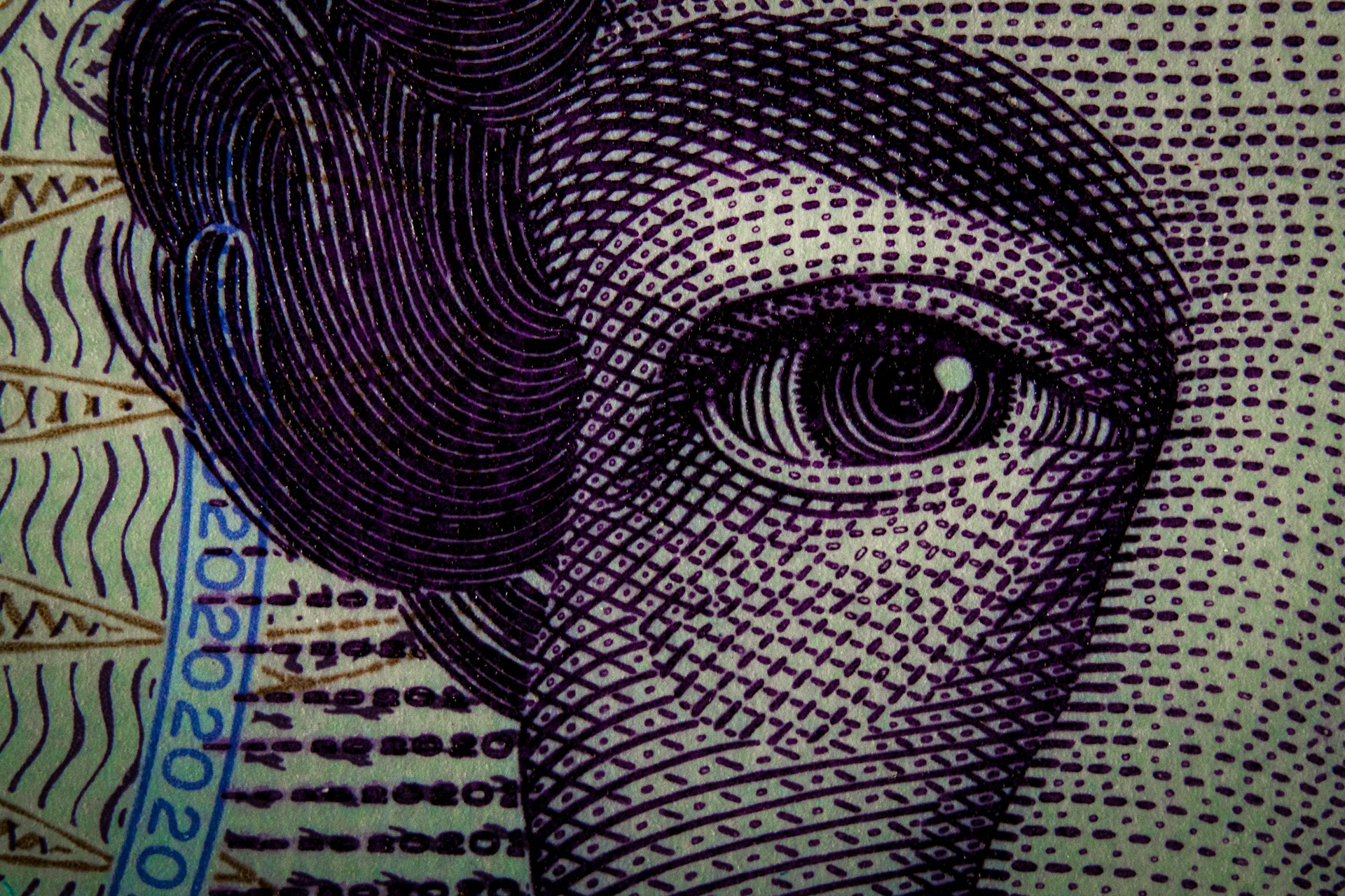 A close up view of a print of a woman's face
